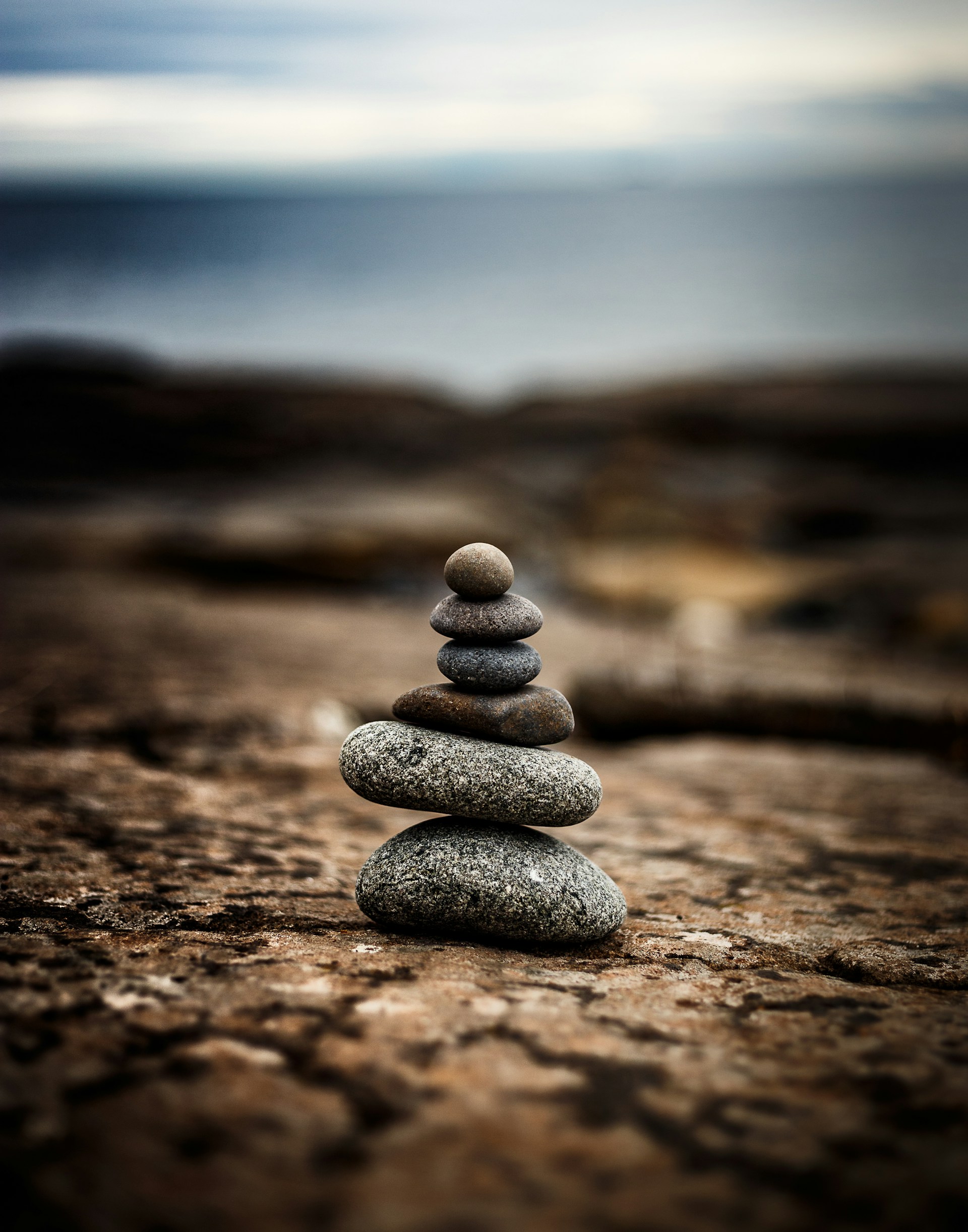 Calm natural scene with meditation rocks stacking one over another one